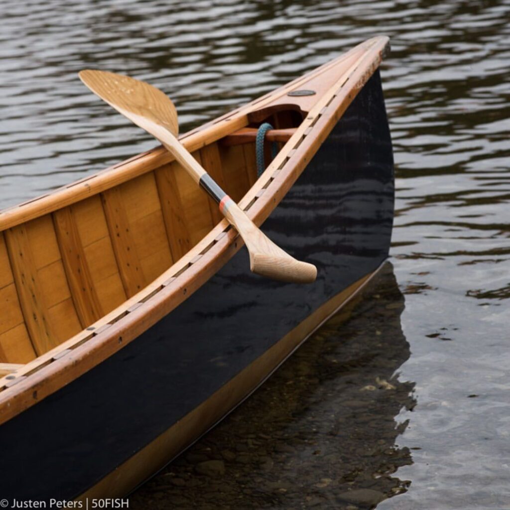 Shaw & Tenney Oar and boat in water