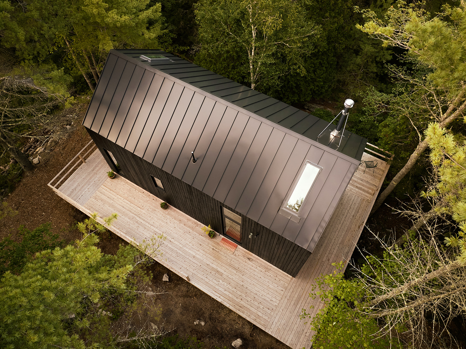 Croft Quote image- 
Overhead shot of home in woods