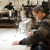Man using sewing machine