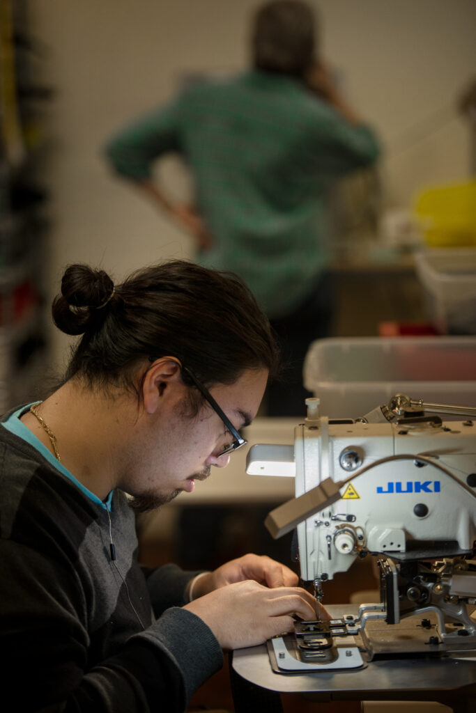 working at sewing machine - close up