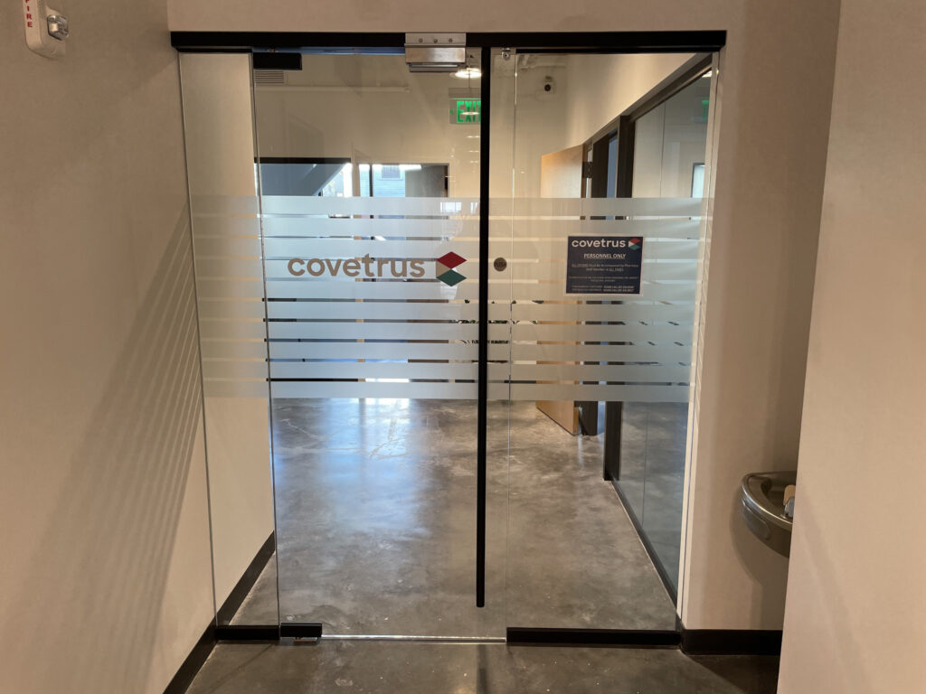Door into Covetrus lab with Covetrus Logo on glass