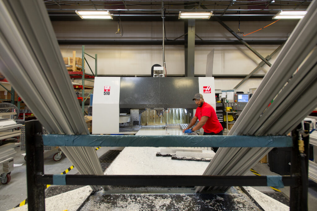 Man working on manufacturing floor at STARC Systems in Brunswick, ME.