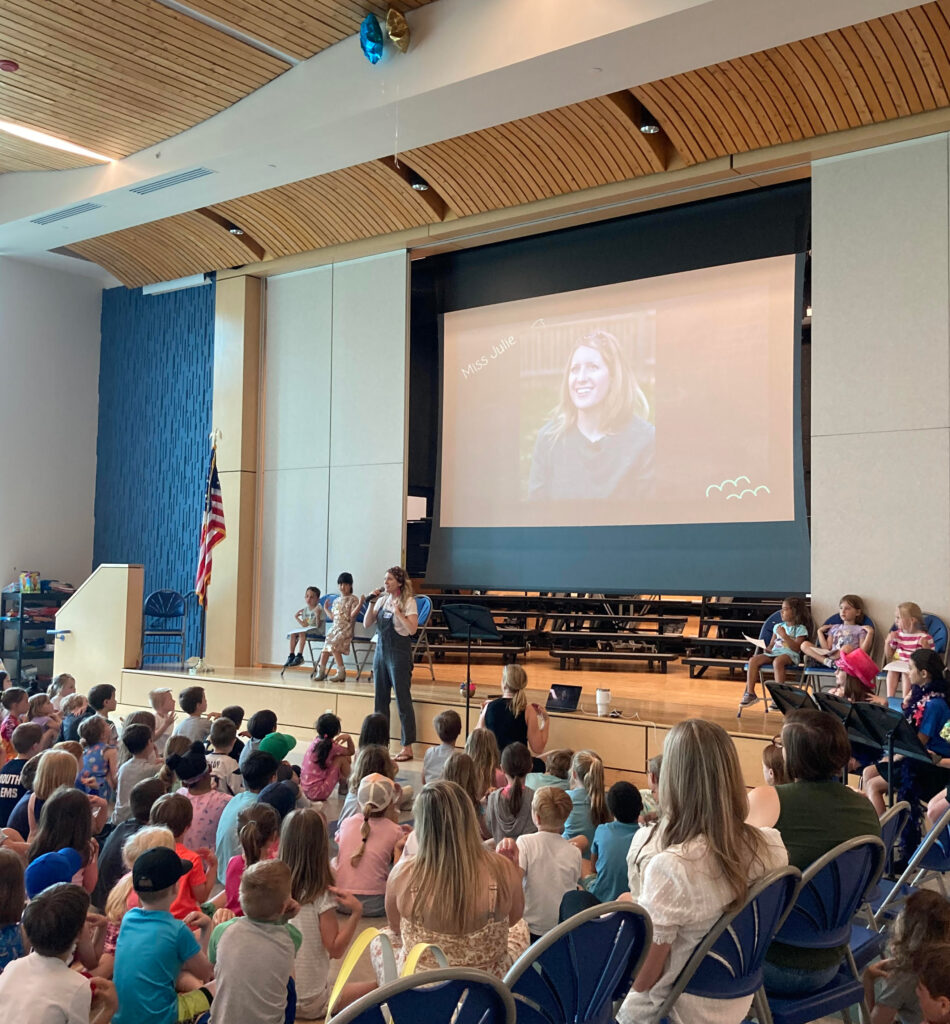 Julie Campilio in front of audience of young students